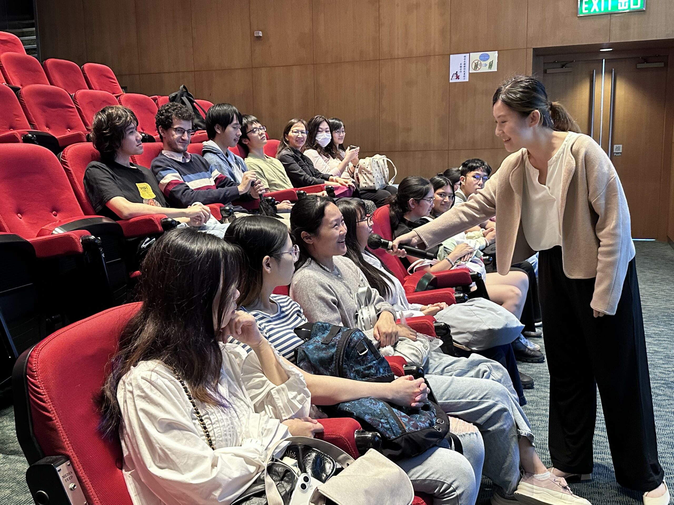 One of the participants is answering the speaker's question with a smile.