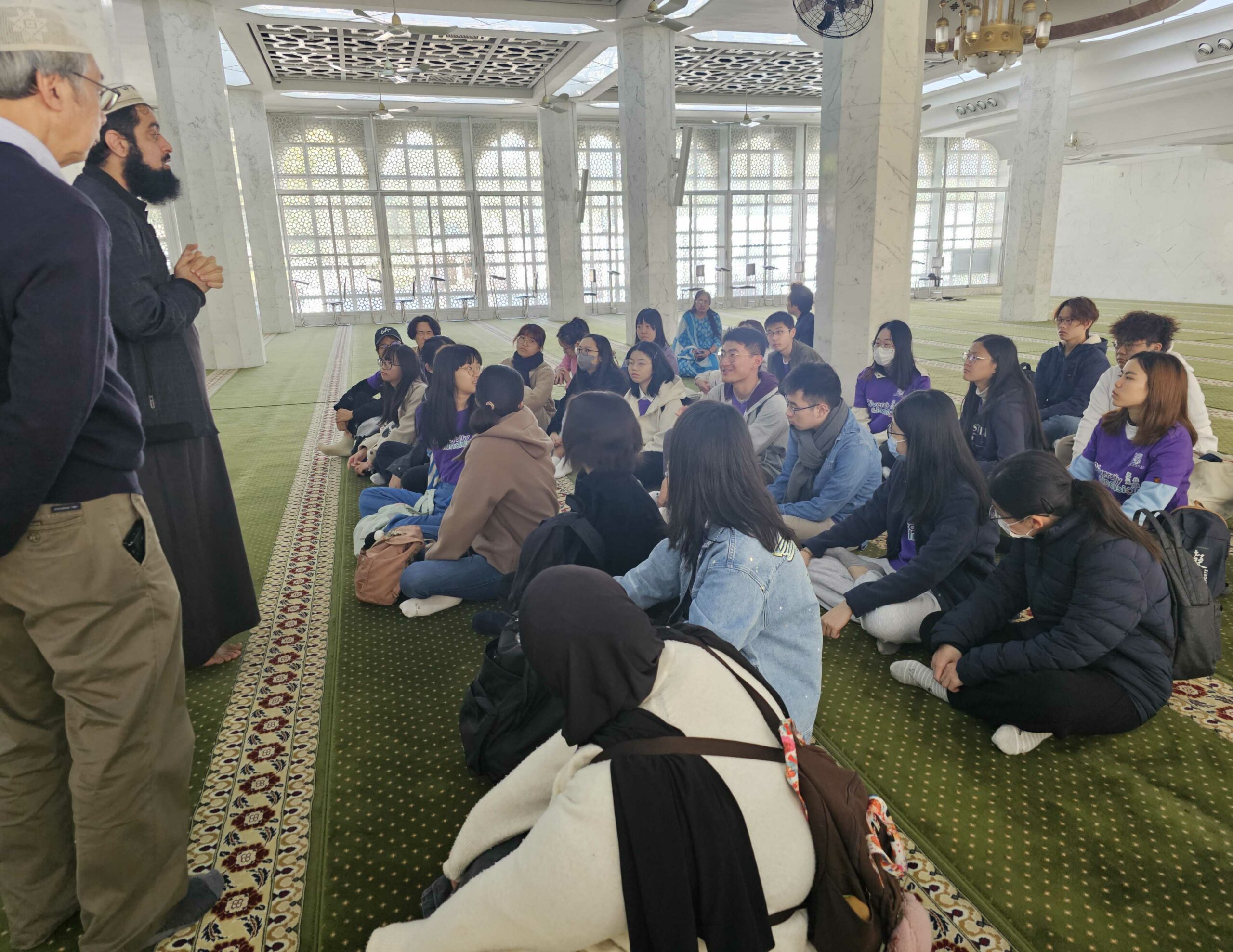 All ambassadors are sitting in the mosque, listening to the introduction from the instructors.