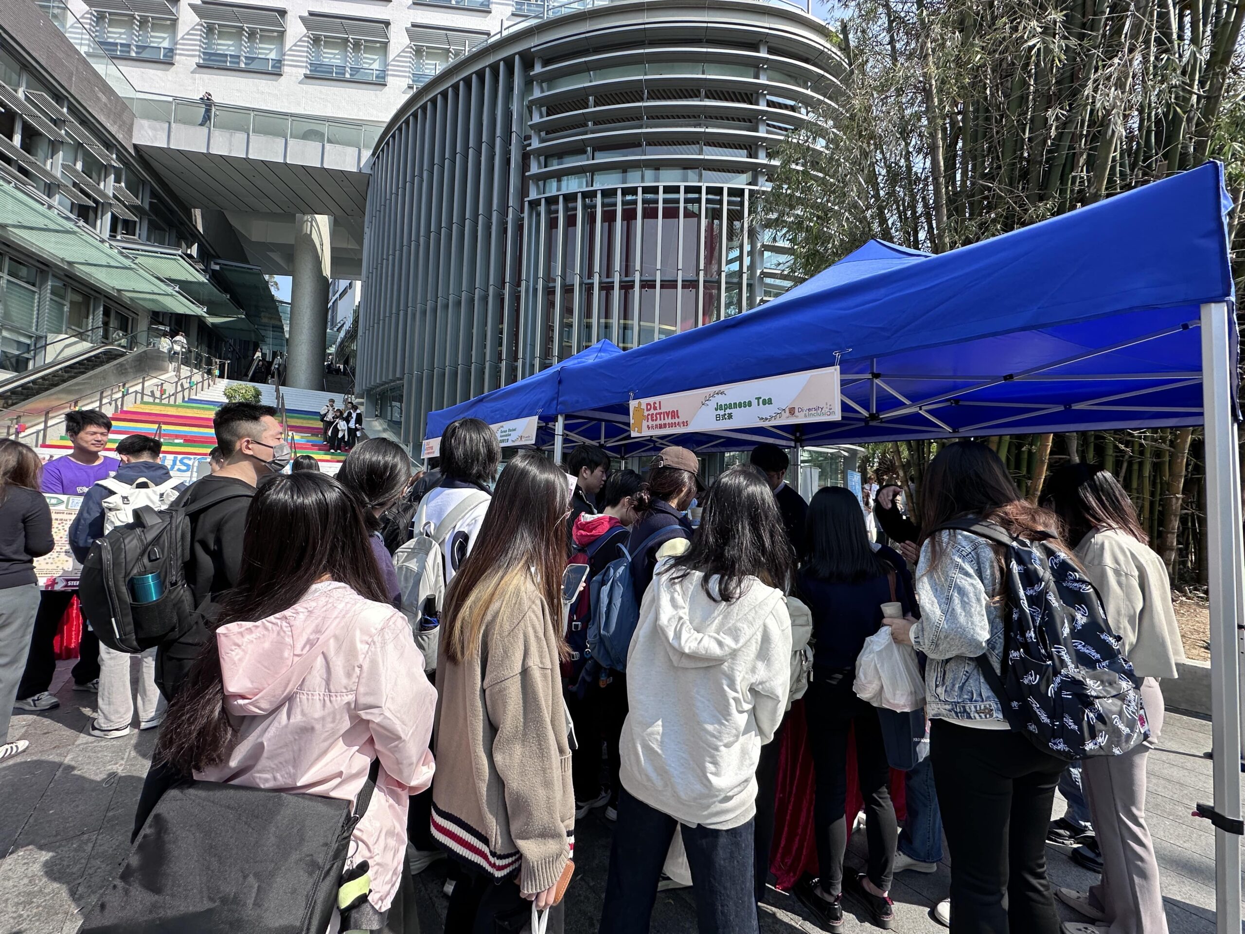 Participants are eagerly queuing for the Japanese tea tasting, excited to experience the delicate flavors and traditional brewing techniques of authentic Japanese tea.